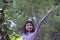 Portraits smiling Asian young girl with pine tree in vintage color