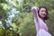 Portraits smiling Asian young girl with pine tree in vintage color