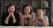 Portraits of woman pose with older mother little daughter indoor