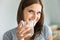 Portraiture of young woman with glass of water