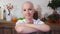 Portrati of a happy cancer survivor woman sitting on a chair, smiling and looking into the camera