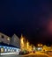 Portree, Isle of Skye , Scotland - October 25 2019 : The main street in Portree is enlightened during the night