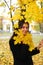 A portret of happy young attractive girl in an autumn park. Cheerful emotions, autumn mood