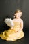 Portret of little girl in yellow dress