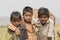 Portret three young boy in Pushkar Camel Mela, India