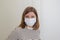 Portret of woman nurse wearing an anti-virus protection mask to prevent flu infection, allergies, virus protection, COVID-19, and