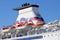 PORTSMOUTH, ENGLAND - MARCH 16 2016: Channel ferry lifeboats and tower against a blue sky.