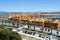 Portugal. Algarve. Portimao. Yellow buildings on blue water background. Horizontal view.