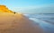 Portugal. Algarve. A tourist photographs the beautiful seascape of the FalÃ©sia beach