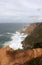 Portugal. Cabo da roca. Rocks on blue atlantic ocean background, vertical view.