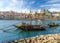 Portugal, city landscape Porto, wooden boats with wine port barrels close up on Douro