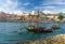 Portugal, city landscape Porto, wooden boats with wine port barrels close up on Douro