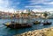 Portugal, city landscape Porto, wooden boats with wine port barrels on Douro river