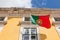 Portugal flag waving on the wind in front an administrative building