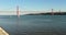 Portugal, Lisbon, Av. Brasi­lia, view of the waters of the bay and the 25th of April Bridge