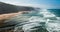 PORTUGAL, Praia do Magoito - Magoito Beach viewed from above. Magoito view with big vawes and misty, foggy air in September.