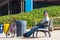 Portugal, Praia Santa Rita Norte, October 04, 2018: An elder man with sunglasses sits on a bench at the beach