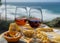 Portugal`s traditional food and drink, glass of porto wine, muscatel de setubal and sweet dessert Pastel de nata egg custard tart