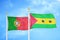 Portugal and Sao Tome and Principe two flags on flagpoles and blue sky