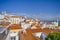 Portugal Travel Destinations. Sunny Picturesque Line of Traditional Tiled Rooftops of Lisbon City in Portugal