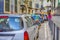 Portugal Travel Ideas. Blurred Image of People Traveling Through the Colorful Streets of Lisbon With Line of Cars