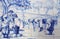 Portugal. Typical historical ceramic `azulejo` tiles depicting farm workers planting seeds.