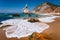 Portugal Ursa Beach at atlantic ocean coast. Foamy wave at sandy beach with surreal jugged rock in coastline picturesque