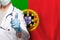 Portugese doctor\'s hand showing thumb up positive gesture on flag of Portugese background