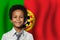 Portugese kid boy on flag of Portugal background. Education and childhood concept