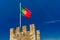 Portuguese flag on fortress wall, Lisbon, Portugal