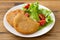 Portuguese meat cookies with fresh salad on white dish
