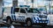 Portuguese police car parked in front of Faro International Airport