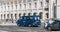 Portuguese policeman in a police van watching tourists in front of the holy mary church of Belem