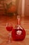 Portuguese rose semi-dry wine MATEUS ROSE. bottle and glass of wine in the room interior