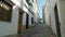 Portuguese streets in the southern town of Tavira, with historic traditional houses. Shooting with a stabilizer.