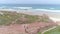 Portuguese surfers walking panorama aerial 4k