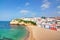 Portuguese villa in Carvoeiro beach with clear blue sea.