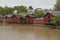 Porvoo, Finland, 09 August 2020 The Porvoonjoki river embankment and the famous red barns stored goods and exotic