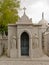 Posh grave monument with statues of a man and a woman in Alto de Sao Joao cemetery, Lisbon