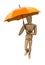 Posing wooden manikin with umbrella.