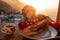 Positano - Breakfast during sunrise with view on the scenic village Positano at the Amalfi Coast, Italy, Europe