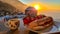 Positano - Breakfast during sunrise with view on the scenic village Positano at the Amalfi Coast, Italy, Europe