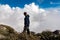 Positano - Hiking man with scenic view from Monte Comune on thick clouds near Positano at the Amalfi Coast, Campania, Italy.