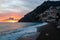 Positano - Scenic sunset view of the Fornillo Beach and colorful buildings of village Positano at Amalfi Coast, Italy