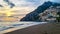 Positano - Scenic sunset view from Marina Grande Beach on colorful buildings of village Positano at Amalfi Coast, Italy