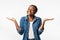 Positive African Girl Shrugging Shoulders Smiling To Camera, Studio Shot