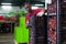 Positive Afro workman stacking boxes with harvested peaches on fruits sorting department