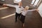 Positive aged dance couple waltzing in the dance studio