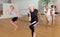 Positive aged woman practicing vigorous dance movements