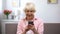 Positive aged woman using smartphone, online shopping, social network chatting